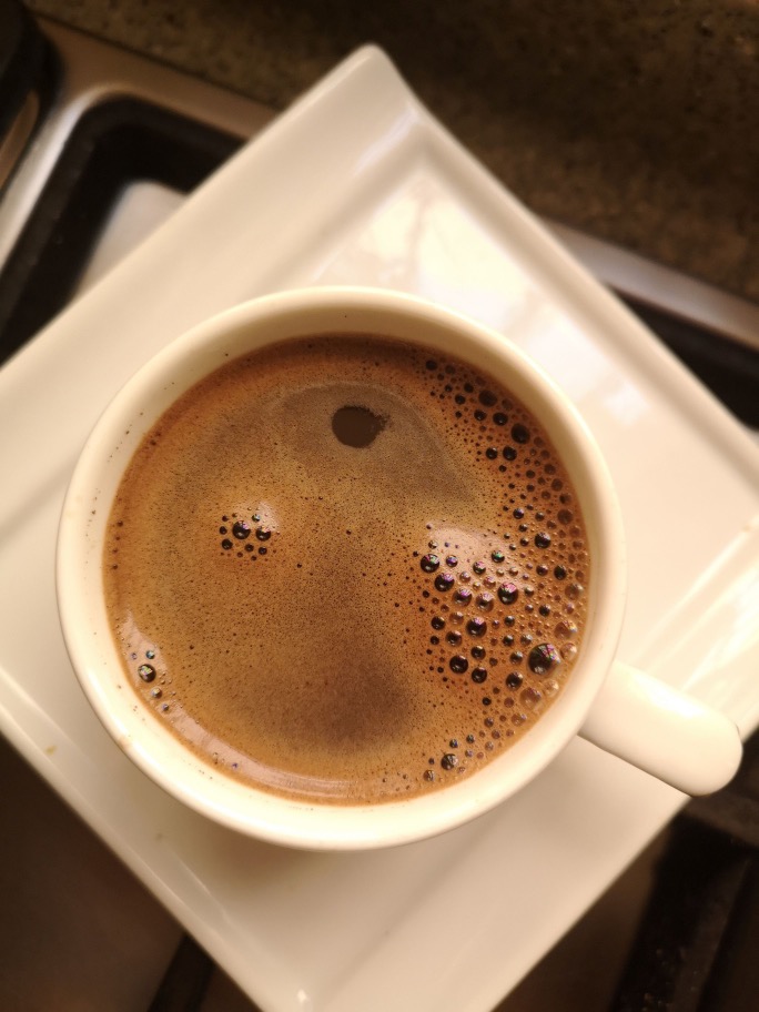A cup of Italian espresso with crema