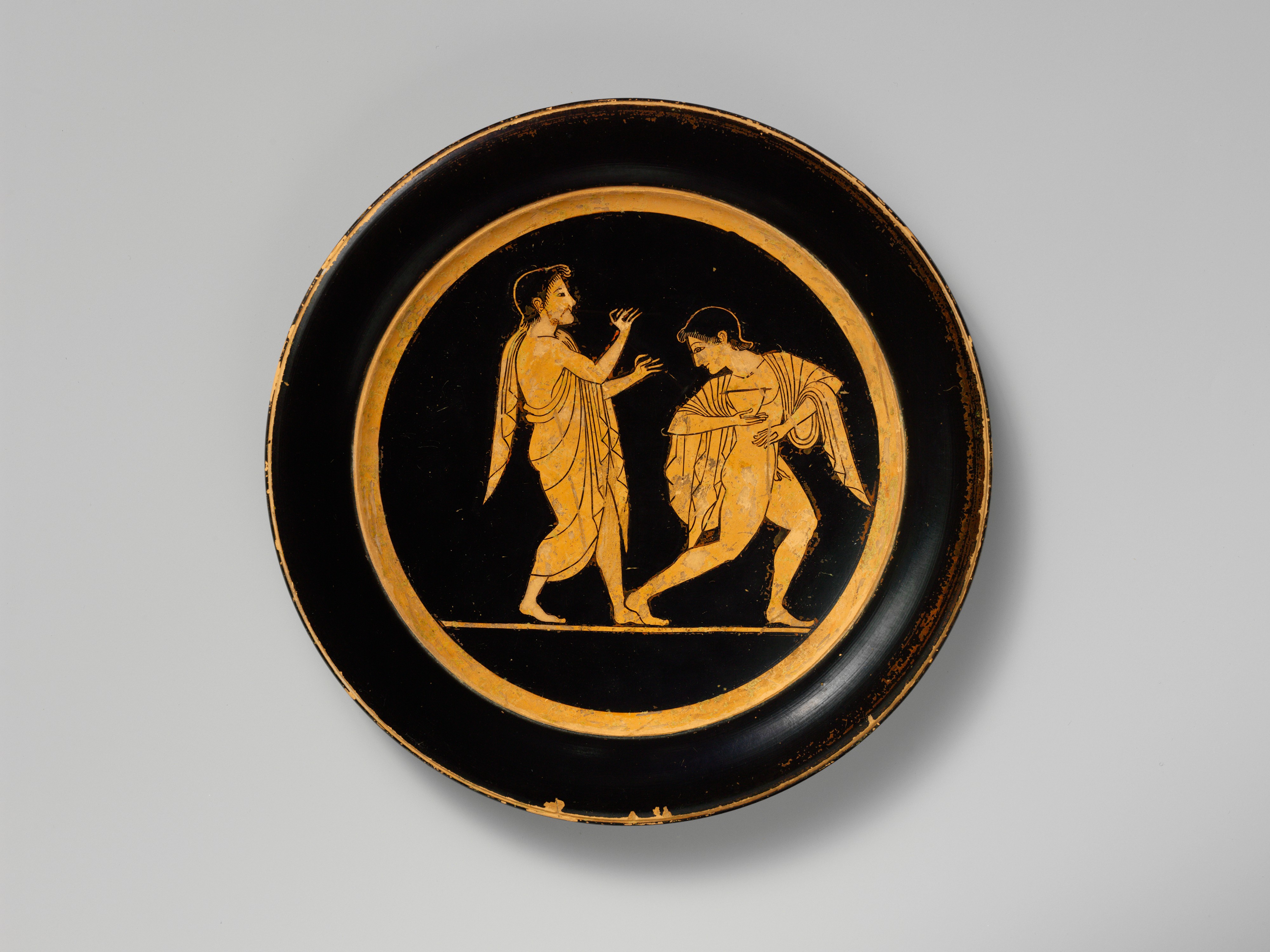 Ancient Greek terracotta plate from around 510 BCE, illustrating the meaning of the Greek word pinax.